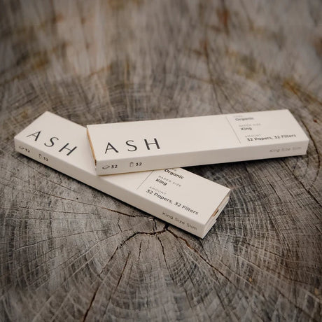 ASH Organic King Size Rolling Papers, 32-Pack, displayed on wooden surface