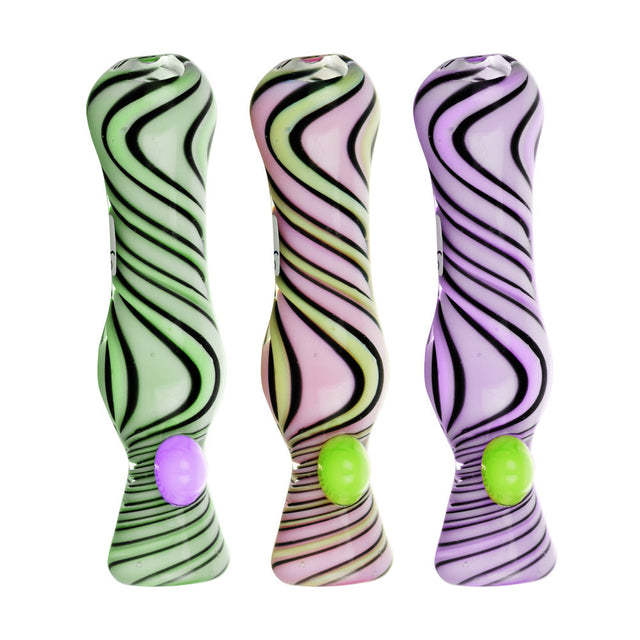 Assorted pastel-colored taster pipes with black swirl design, front view, perfect for dry herbs