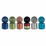 Assorted Piranha 4 Piece 2.2" Aluminum Grinders in multiple colors displayed in a row