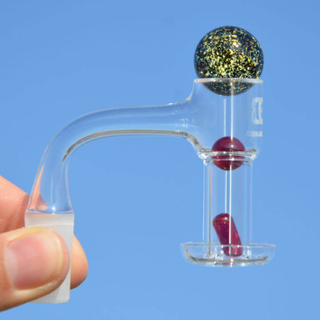 Dank Banger Quartz Terp Slurper Combo Set, 25mm, 14mm Male Joint, held against blue sky