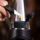 Puffco Hot Knife electronic heated dab tool in use with concentrate close-up