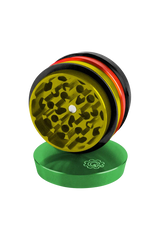 Pulsar 2" Aluminum 4pc Grinder in Rasta colors, top view showing sharp teeth for dry herbs