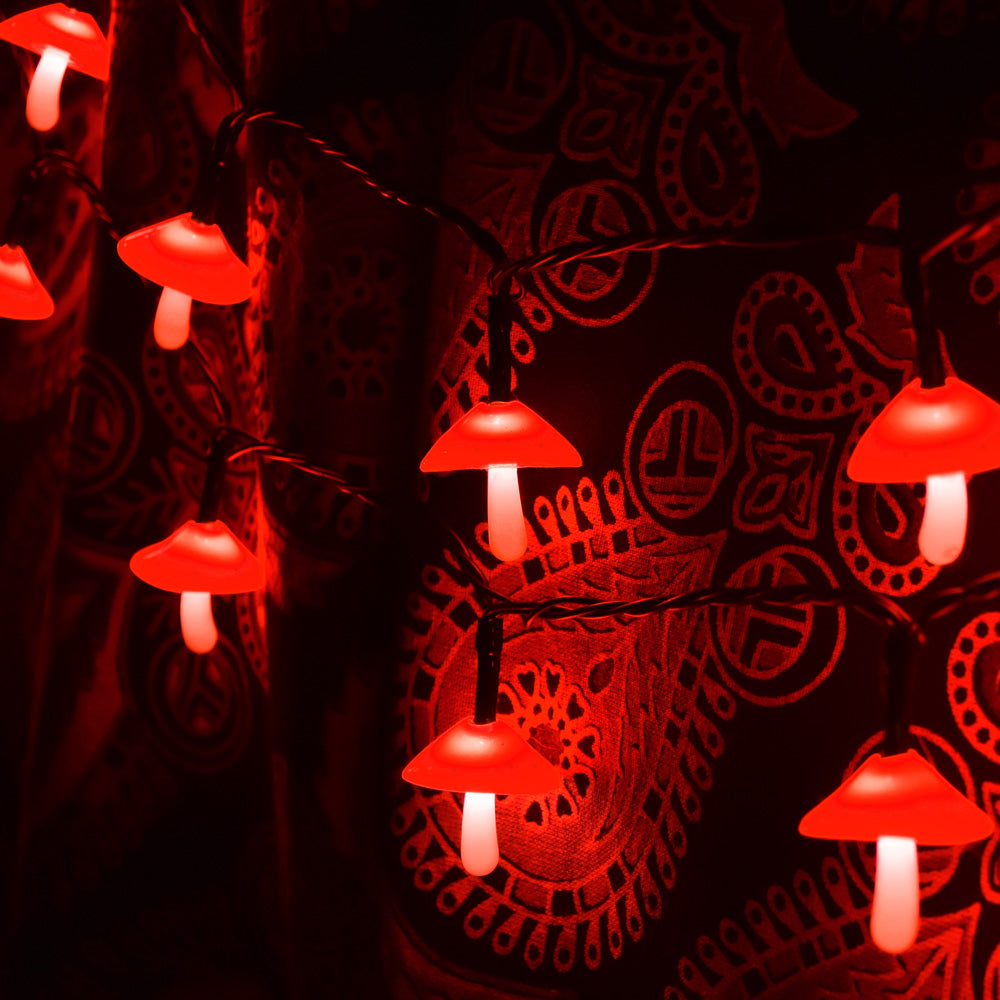 Pulsar Mini Shrooming LED String Lights with 50 red mushroom caps illuminating in dark room