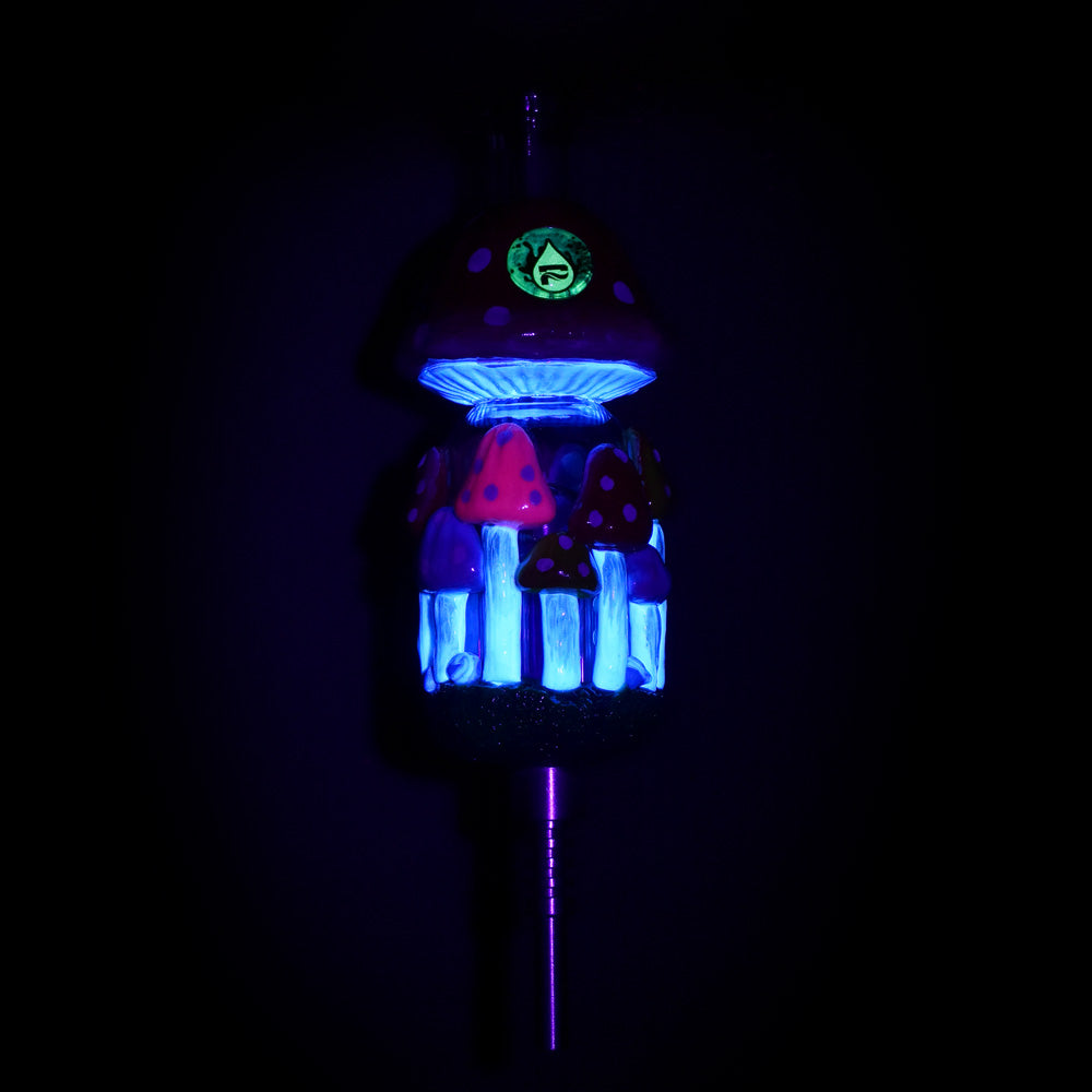 Pulsar Shroom Forest Vapor Vessel with Titanium Tip glowing in dark, front view