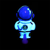 Pulsar Spaceman Hand Pipe in Borosilicate Glass, glowing in the dark, front view on a black background