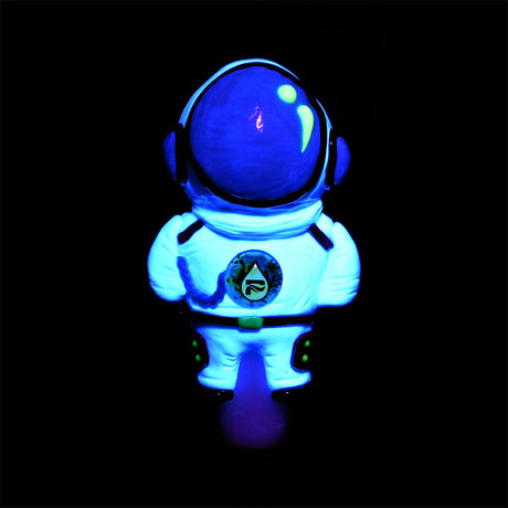 Pulsar Spaceman Hand Pipe in Borosilicate Glass, glowing in the dark, front view on a black background