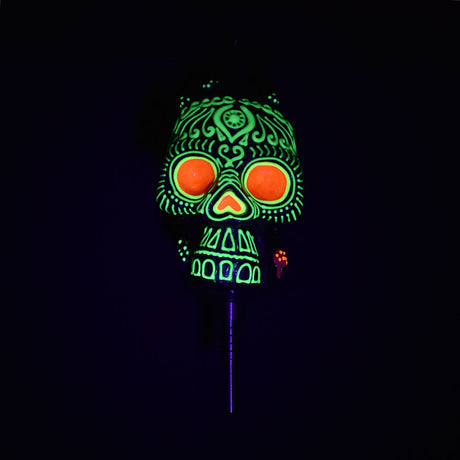 Pulsar Voodoo Skull Vapor Vessel with glowing green and orange design, Ti tip visible, front view