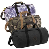 Revelry The Overnighter Smell Proof Duffel Bags in various patterns displayed in a stack