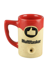 Roast & Toast Ceramic Mug Pipe in Rasta colors, front view with 'Multitasker' text and smoking bowl feature