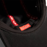 Close-up of RYOT x Chocolate 5 Panel Stash Cap in Black with Secret Stash Pocket Detail