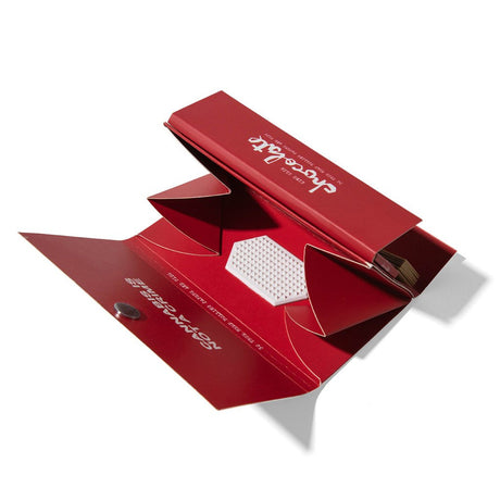 RYOT x Chocolate Rolling Papers pack with Built-In Grinder on white background