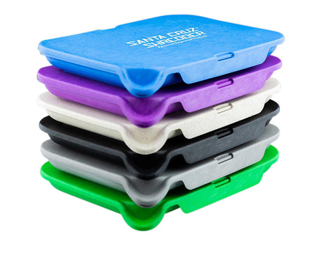 Stack of Santa Cruz Shredder Small Hemp Tray Sifters in assorted colors, portable and biodegradable