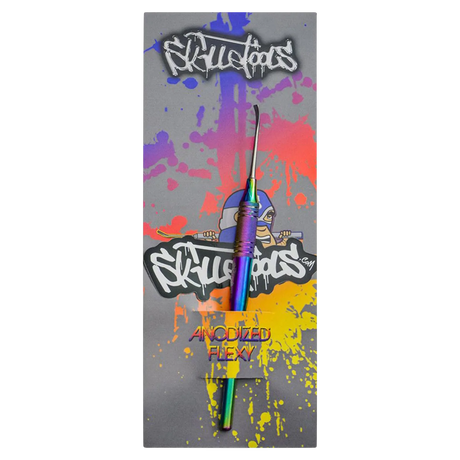 Skilletools Anodized Series Dab Tool with rainbow finish on colorful splattered background