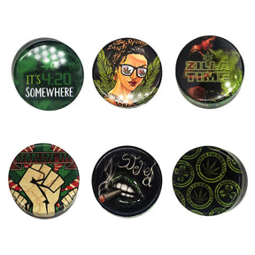 Assorted Smokezilla Tin Safety Containers, 3" size, 12 pack, featuring novelty designs, top view