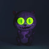 Empire Glassworks Galacticat Dry Pipe with glow-in-the-dark eyes, front view on dark background