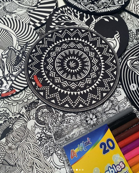 StonerDays Creativity Mat with vibrant designs, perfect for dab rig setups, angled view