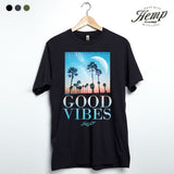 StonerDays Good Vibes Hemp Tee in Caviar Black with Tropical Print, Front View on Hanger