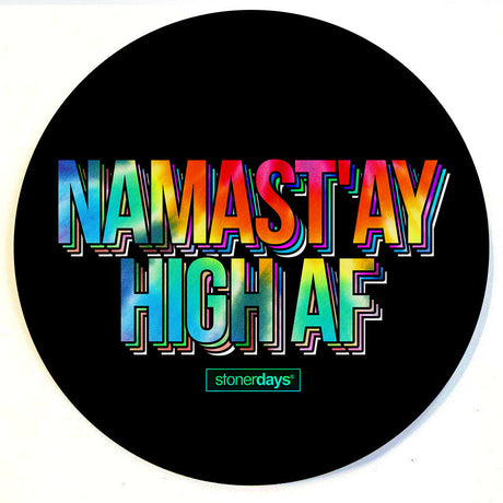 StonerDays Namastay High Af Dab Mat in black with colorful lettering, 8" diameter, top view