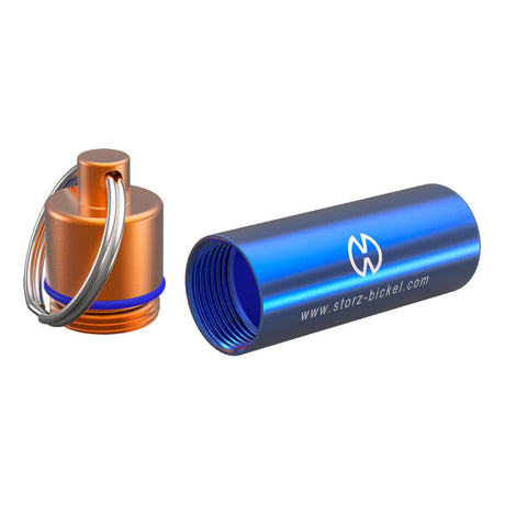 Storz & Bickel Capsule Caddy in blue silicone with orange lid and keychain for dry herb vaporizers