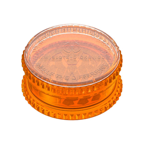 Storz & Bickel 2pc Herb Mill in orange acrylic, top view showcasing textured grip