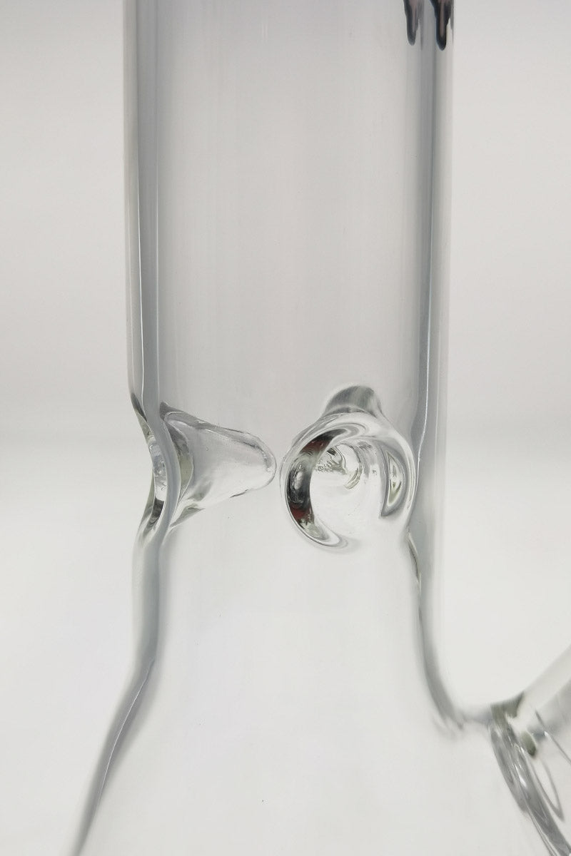 Close-up view of TAG 12" Beaker Bong's 18/14MM downstem and sturdy base, clear glass
