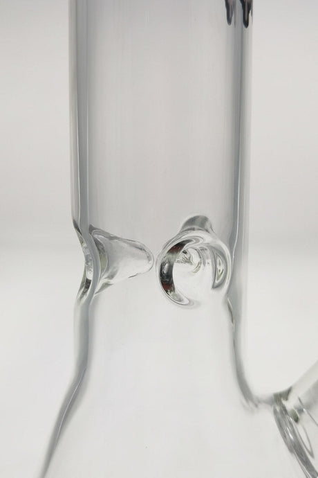 Close-up view of TAG 12" Beaker Bong's 18/14MM downstem and sturdy base, clear glass