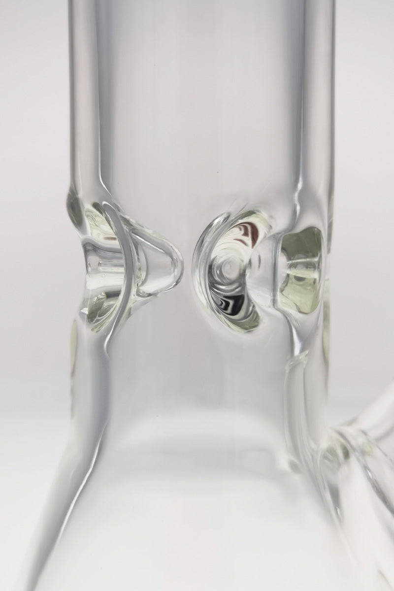 Close-up of TAG 12" Beaker Bong's clear glass 18/14MM downstem on white background