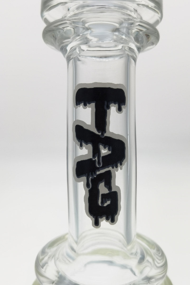 Close-up of Thick Ass Glass logo on clear glass dab rig with honeycomb percolator
