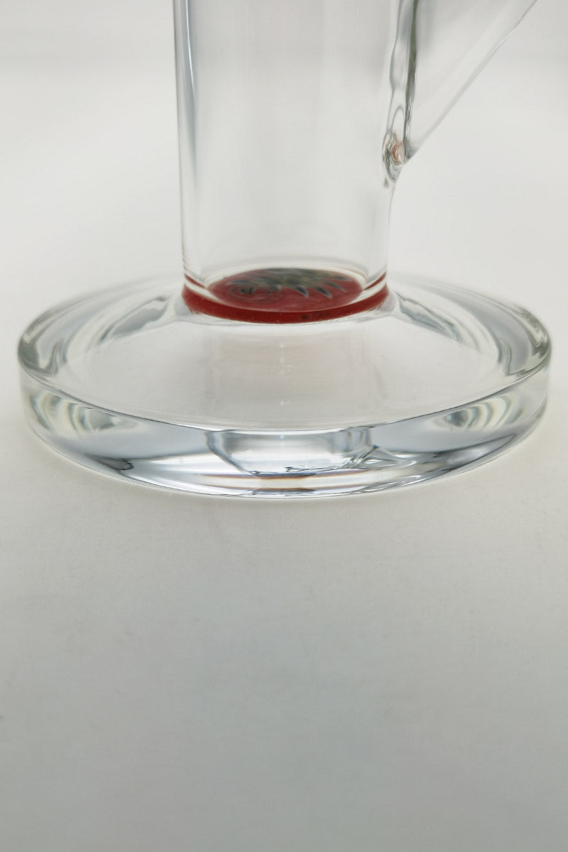 Close-up of TAG 12" Straight Tube Bong base, clear with red accents, 44mm diameter