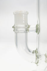 Close-up of TAG 12" Super Slit Bellow UFO Bong joint, 90 Degree 18MM Female, clear glass