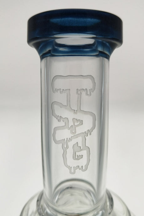 Close-up of TAG 12" Super Slit Matrix Diffuser with blue rim, showcasing the branded glass detail.