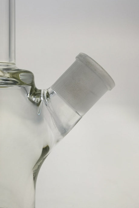 Close-up of TAG 14" Beaker Bong joint with 18/14MM downstem on a clear glass base