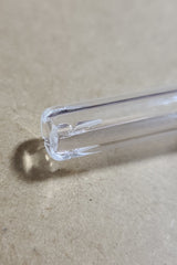 Close-up of TAG Quartz Closed End Showerhead Downstem for Bongs on a neutral background