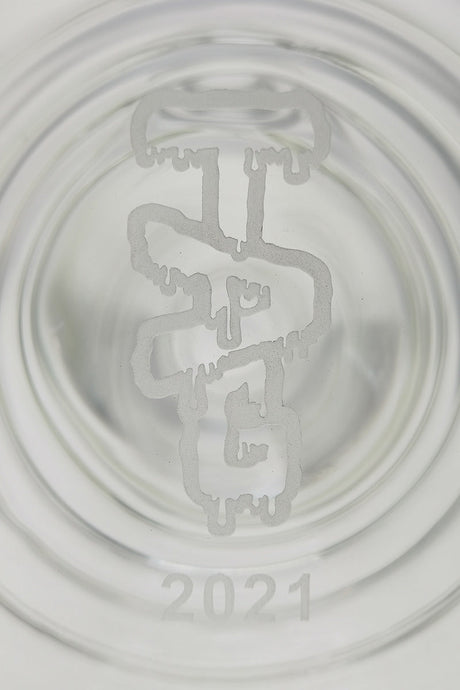 Close-up of TAG 16" Beaker Bamboo Bong base with 2021 imprint, showcasing 7mm thickness and clarity.