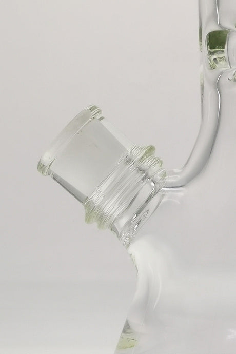 Close-up of TAG 18" Beaker Bong 50x9MM downstem, showcasing its thick quartz build and Rasta color accents