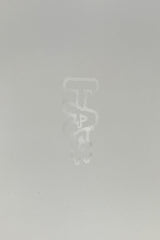 TAG logo close-up on a seamless white background, indicative of Thick Ass Glass bong quality