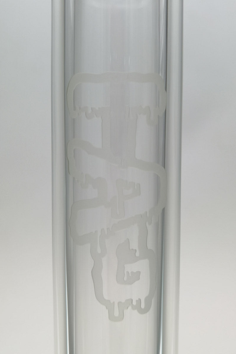 Close-up of TAG 24" Beaker with 50x9MM thickness, showcasing the etched logo on heavy wall glass