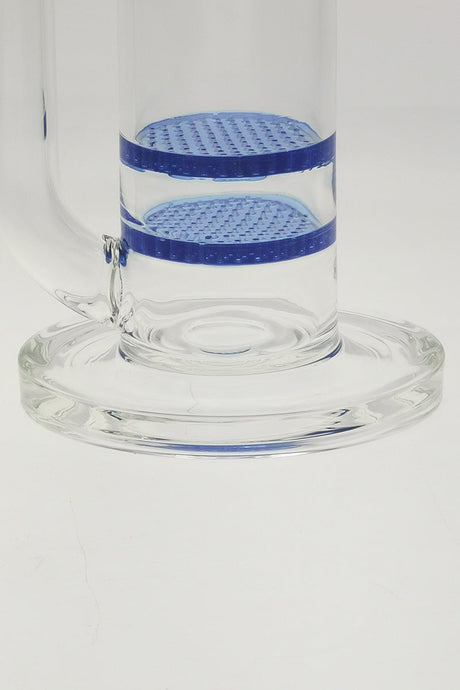 Close-up of TAG bong base with double honeycomb and showerhead percs, light blue accents.