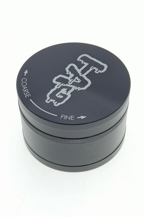 TAG 3" Black Four Chamber Grinder with 120 Micron Mesh & Wavy Engraved Logo - Front View