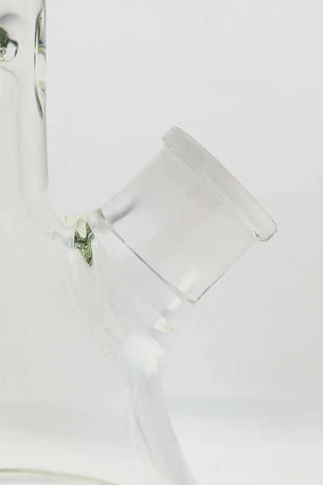 Close-up of TAG 30" Rasta Beaker Bong's 28/18MM downstem, showcasing heavy wall thickness.
