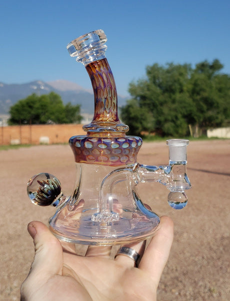 TAG 5" UFO Banger Hanger Dab Rig with Super Slit Showerhead Percolator held in hand outdoors