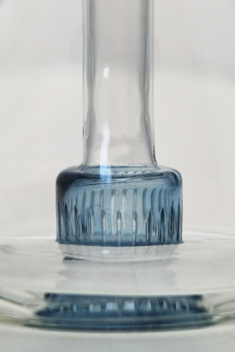 Close-up of TAG 6" Fixed Showerhead Puck Pyramid Rig base with blue accents