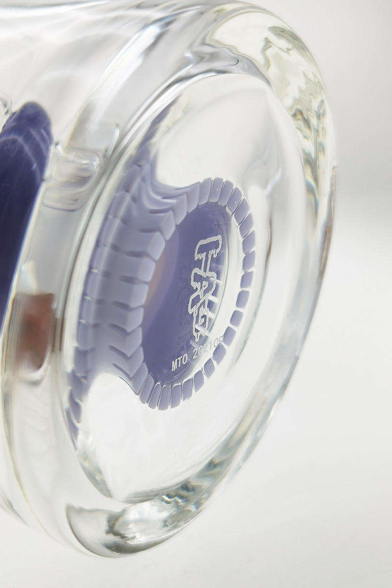 Close-up of TAG 6.5" Super Slit Froth Puck Rig base showing thick glass and frosted logo