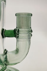 Close-up of TAG 8" Super Slit Puck Klein Incycler joint, 14MM Female, clear glass with green accents