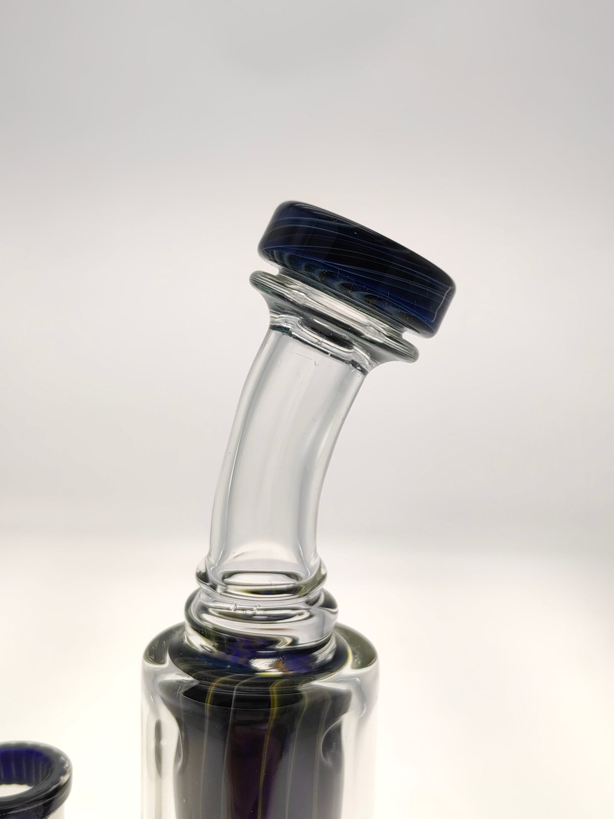 Close-up of TAG 8" Super Slit Puck Klein Incycler's 14MM Female joint with sturdy 4mm glass