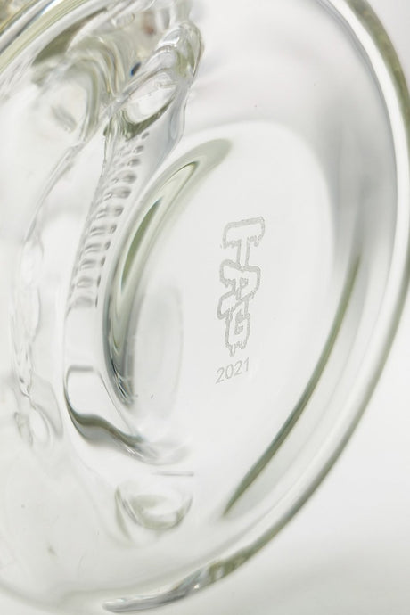 Close-up of TAG logo on 8.25" Inline Bellow Base Recycler Bong by Thick Ass Glass