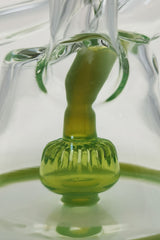 Close-up of TAG 9.5" Super Slit Donut Dual Arm Recycler with 14MM Female joint and in-line percolator