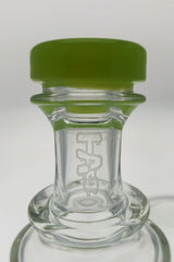 Close-up of TAG 9.5" Super Slit Donut Dual Arm Recycler's 14MM Female joint with TAG logo