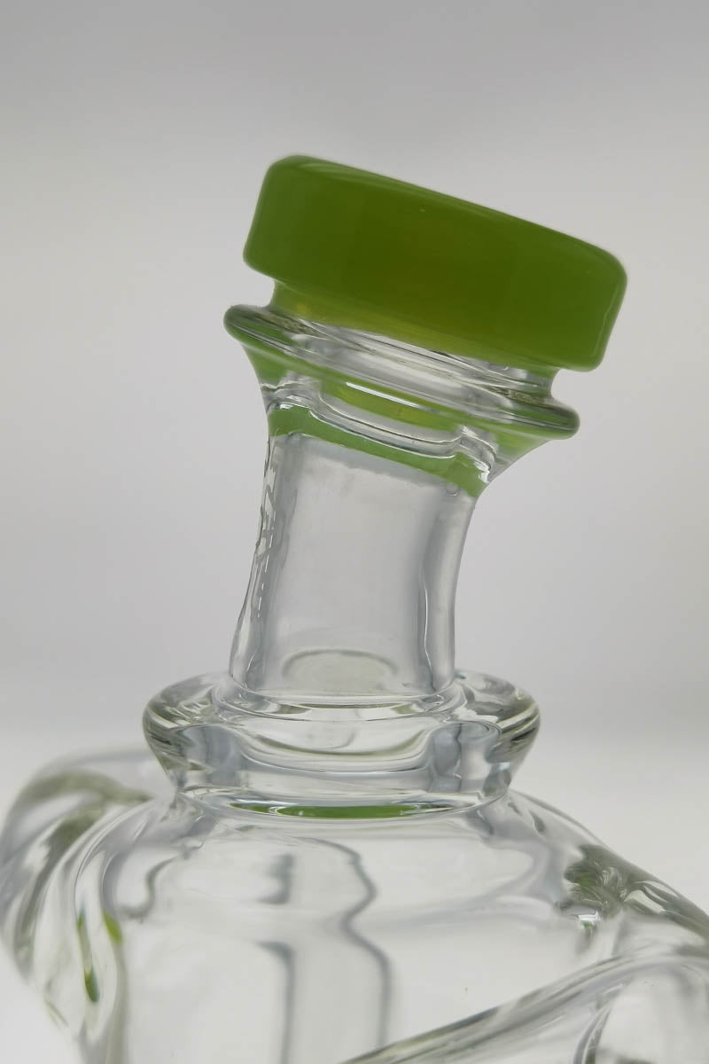 Close-up of TAG 9.5" Super Slit Donut Dual Arm Recycler's 14MM Female joint with green accent