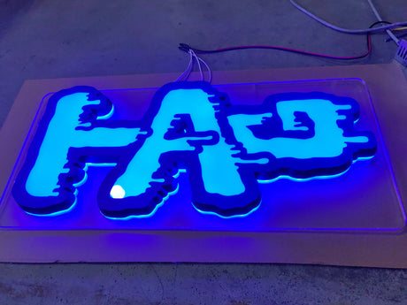 TAG - Bright Blue LED Sign by Thick Ass Glass, Front View on Display
